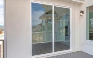 Deck,Of,A,House,With,Reflective,Sliding,Glass,Door,And